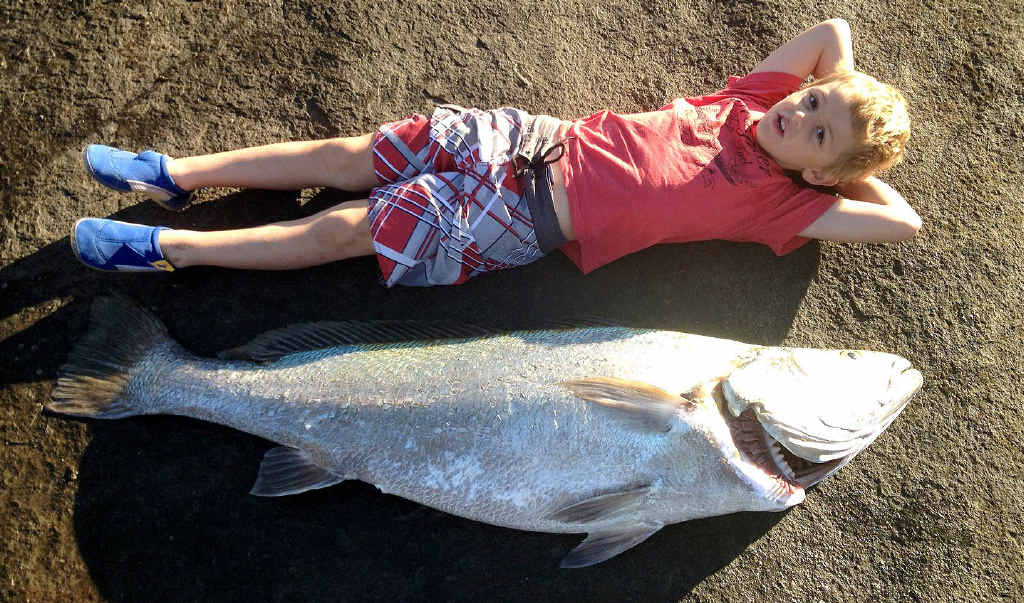 SIZE-ABLE CATCH: Harry Trent relaxes next to his uncle Cameron’s monster jewfish. SIZE-ABLE CATCH: Harry Trent relaxes next to his uncle Cameron’s monster jewfish.